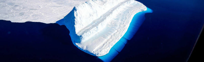 View of a glacier meeting the ocean.