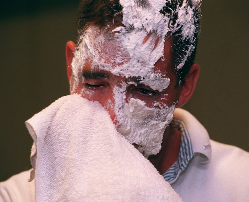Man wipes really expensive cream from his face. 