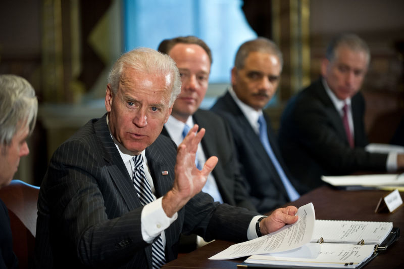 US Vice President Joe Biden speaks to a roundtable of game industry representatives as ESA CEO Mike Gallagher and Attorney General Eric Holder look on.