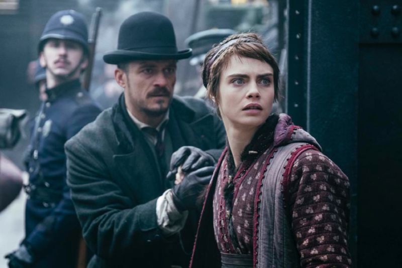 Orlando Bloom and Cara Delevingne star as a human detective and a refugee faerie, respectively, in <em>Carnival Row</em>.