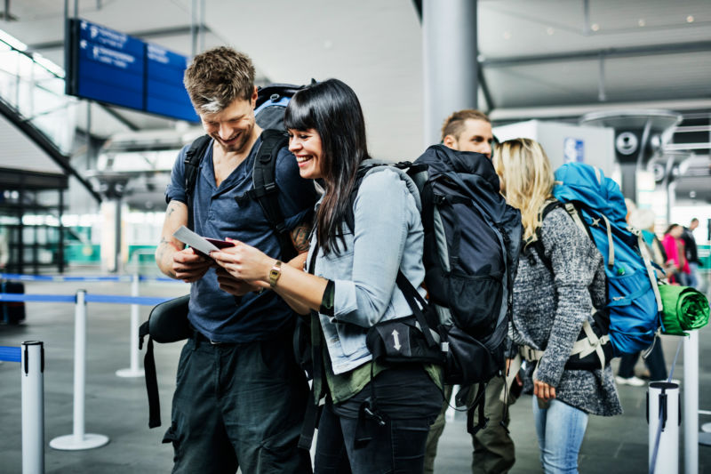 Not all of us frequently travel with camping/hiking backpacks like these joyful stock photo travelers—luckily, we have some recommendations on tech tailored for on-the-go life.