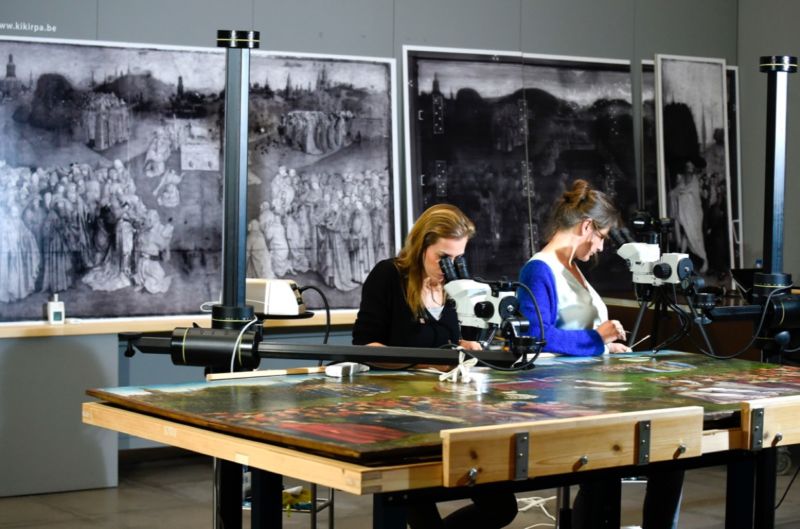 Restorers of the Royal Institute for Cultural Heritage remove surpeints and reveal the original of "Adoration of the Mystic Lamb" altarpiece by Van Eyck brothers.
