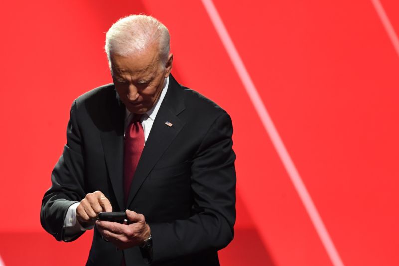 Former Vice President Joe Biden poking at a mobile phone in October, 2019.