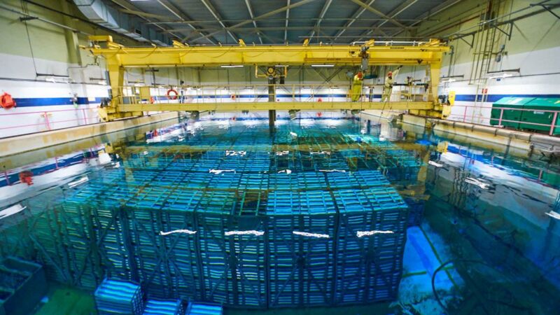 Image of blocks of material submerged under water in a storage facility.