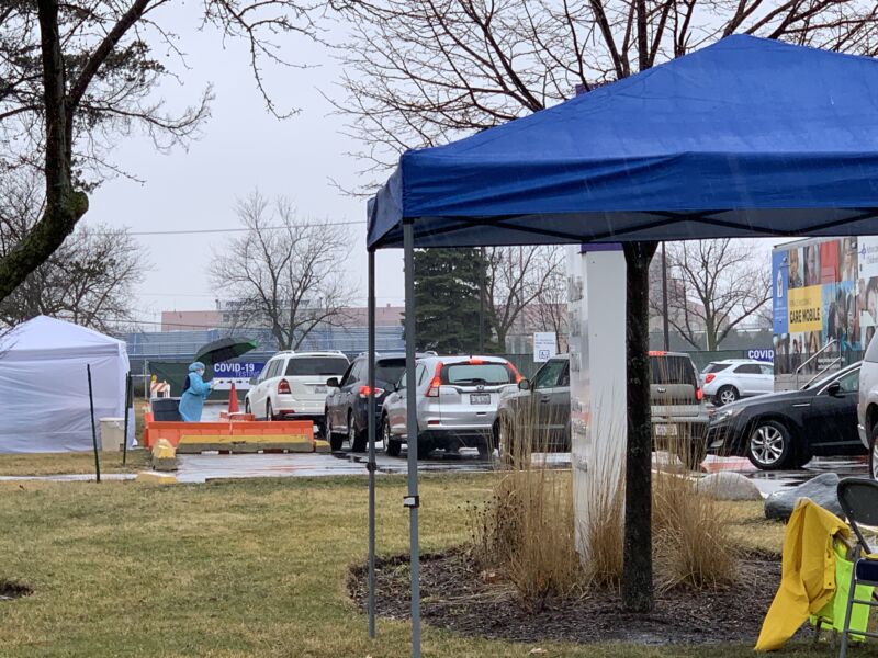 Patients wait in their cars for drive-through COVID-19 testing at Advocate Lutheran General Hospital in Park Ridge, IL on Thursday. The hospital suspended drive-through testing on Friday due to a shortage of test kits.
