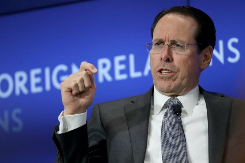 AT&T CEO Randall Stephenson gesturing with his hand and speaking at a conference.
