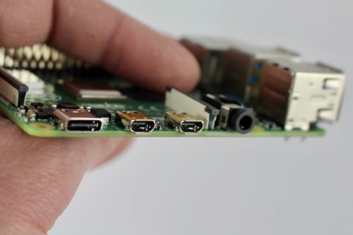 Power (USB-C) socket (left), with two micro-HDMI sockets (middle) and the headphone jack (right)