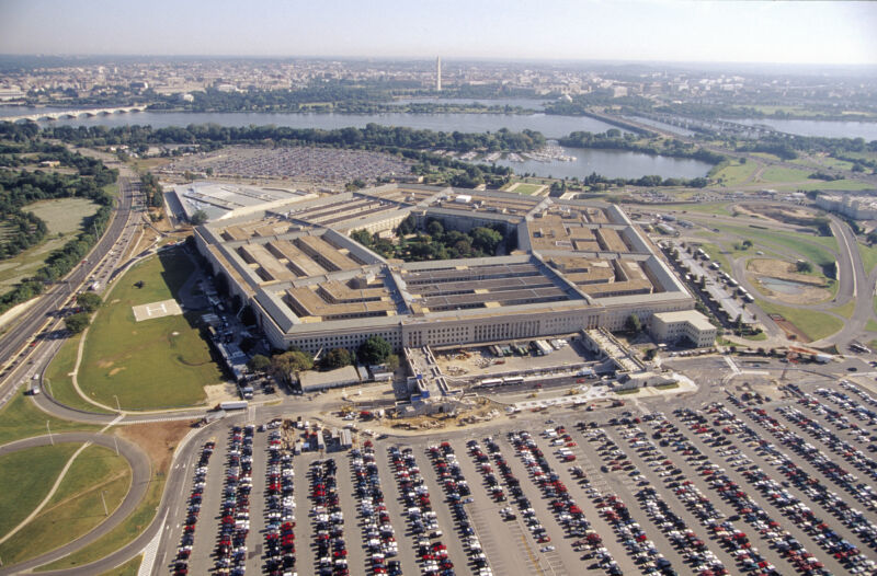An aerial view of the Pentagon, the Potomac river, and parts of Washington, DC, taken back before a pandemic started keeping most of those cars in the commuter lot at home.