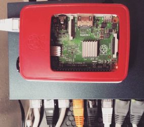 birds eye view of a raspberry pi in a red case