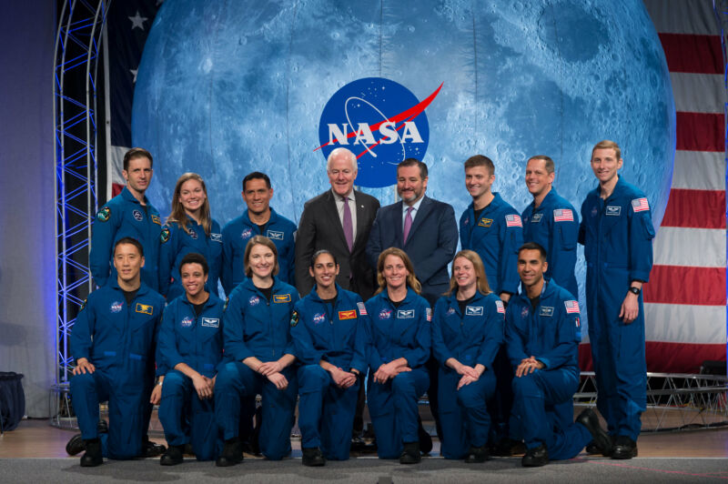 Senator John Cornyn (center, black suit) takes a photo with the 2017 astronaut class.