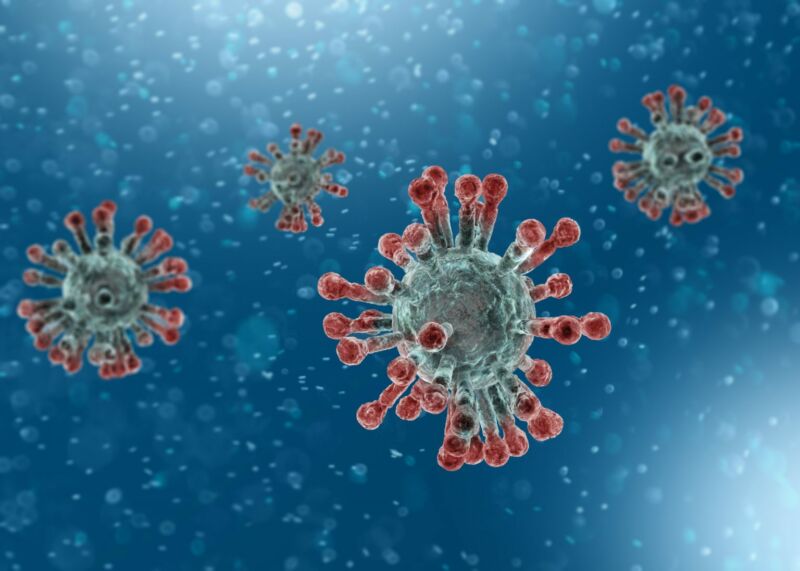 Cartoon image of the virus, showing its spike proteins.