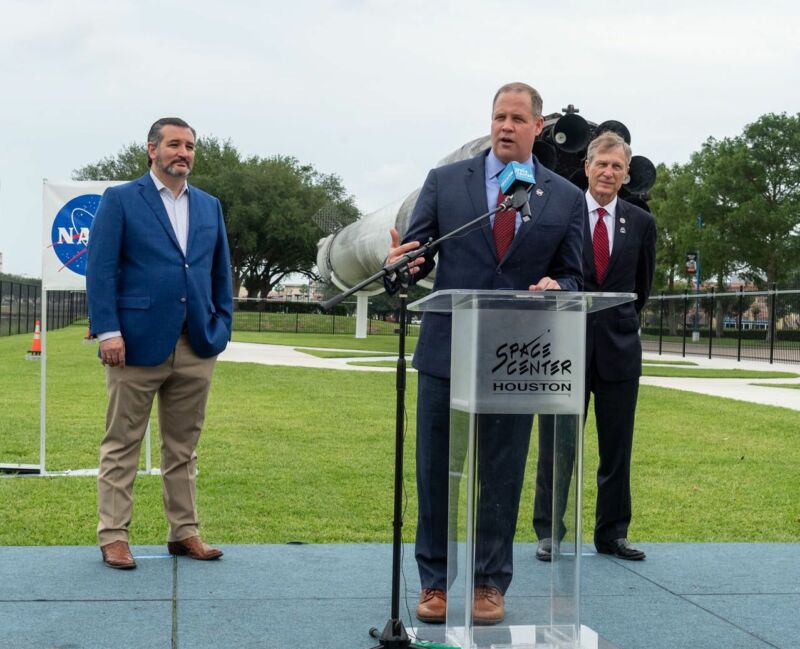 Sen. Ted Cruz, NASA Administrator Jim Bridenstine, and US Rep. Brian Babin stand in front of a flight-proven Falcon 9 rocket at Space Center Houston on Sunday.