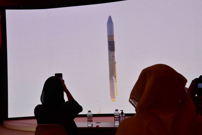 Spectators watch a screen broadcasting the launch of the "Hope" Mars probe at the Mohammed Bin Rashid Space Centre in Dubai on Sunday.