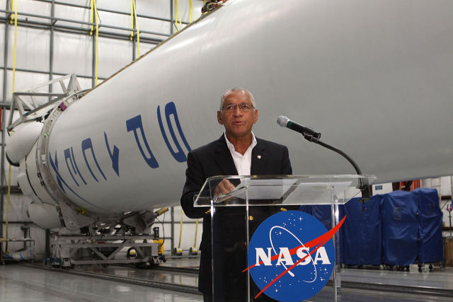 NASA Administrator Charles Bolden speaks in front of Falcon 9 rocket in 2016.