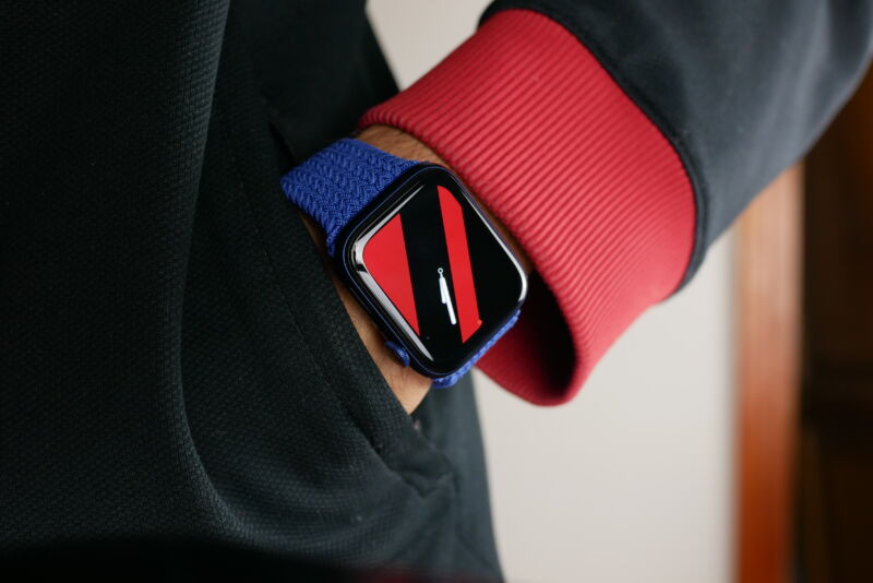 Apple Watch Series 6 on a reviewers wrist, showing the striped watch face