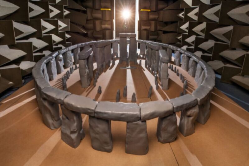 Adorable scale model of Stonehenge inside a large room.