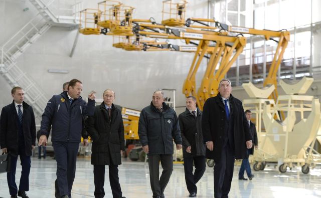 Vladimir Putin, center, and Dmitry Rogozin, far right, tour Russia's new Vostochny Cosmodrome in October, 2015.