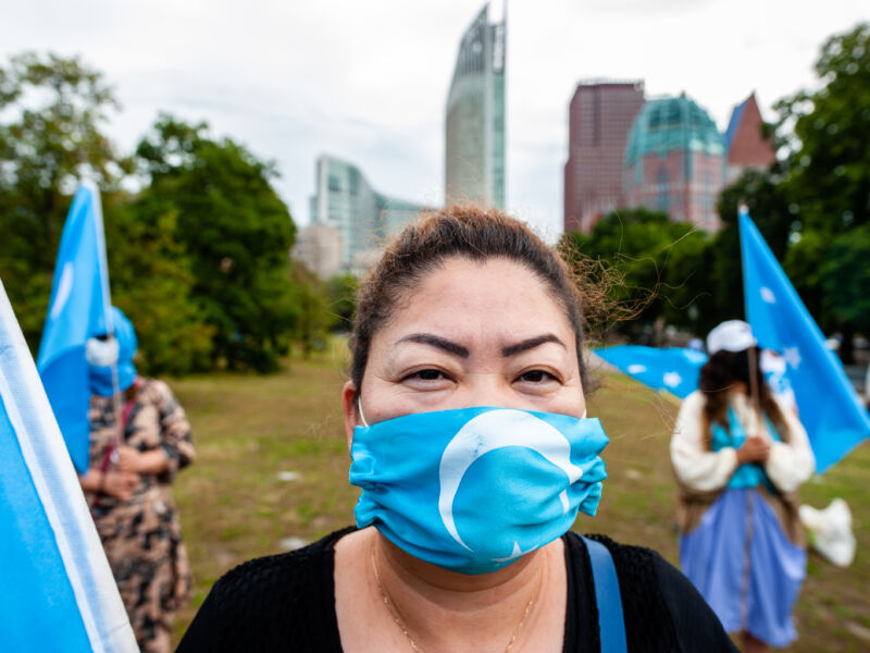 A woman is wearing a mask with the Uyghurs flag on it, during the demonstration 'Freedom for Uyghurs' in The Hague, Netherlands on August 20th, 2020.