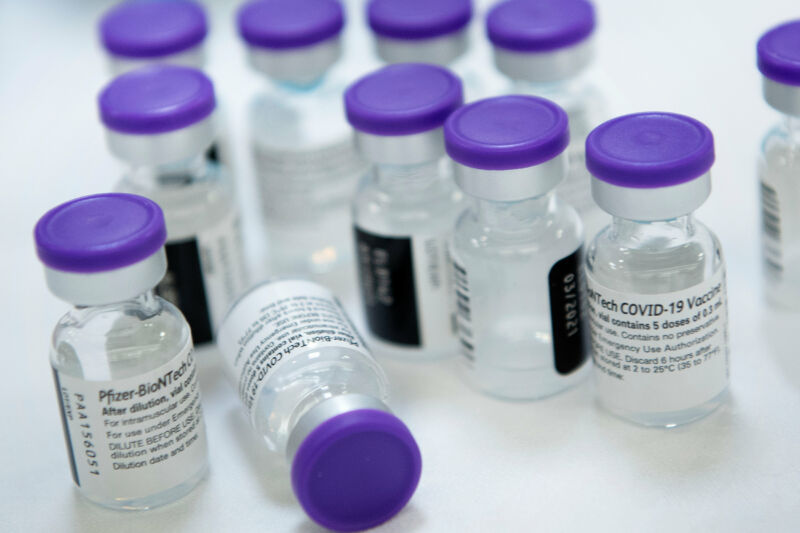 Vials of undiluted Pfizer COVID-19 vaccine are prepared to administer to staff and residents at the Goodwin House Bailey's Crossroads, a senior living community in Falls Church, Virginia, on December 30, 2020.