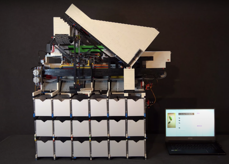 A front view of the LEGO sorter with the sorting boxes visible underneath