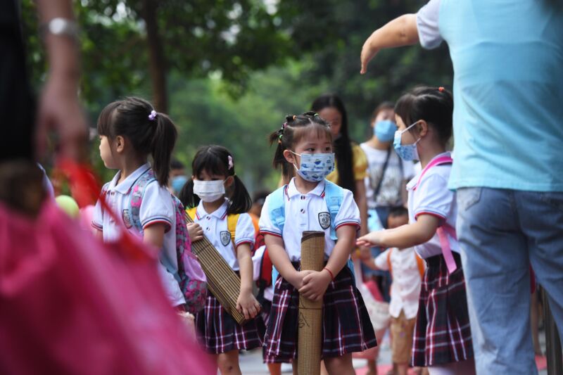 Young children go back to kindergarten following COVID-19 lockdown.