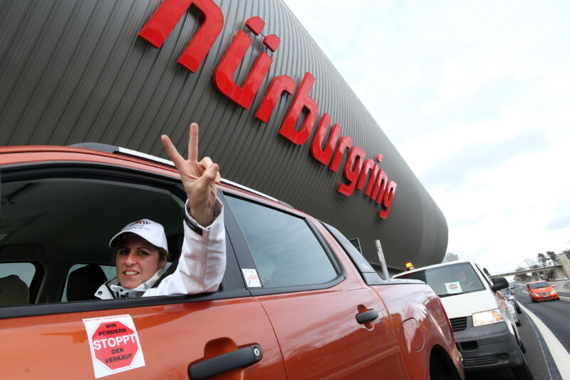 Sabine Schmitz sitting in her car during a car parade at the Nürburgring race track in 2014.