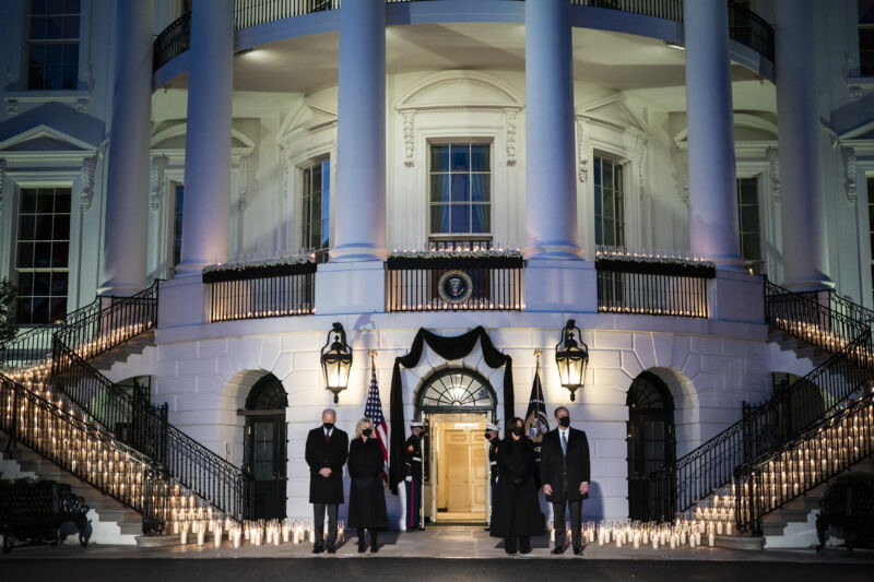 President Joe Biden, First Lady Jill Biden, Vice President Kamala Harris, and Second Gentleman Doug Emhoff participate in a moment of silence and candle light ceremony at sundown with 500 candles for the 500,000 dead from the COVID-19 pandemic, at the South Portico at the White House on Monday, Feb. 22, 2021 in Washington, DC.