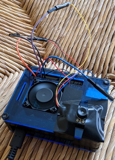 camera attached to raspberry pi in a case