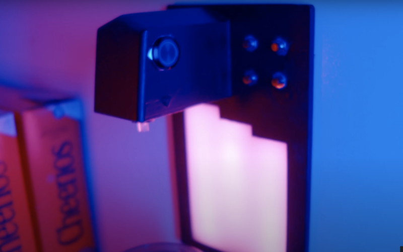 Water dispenser mounted onto side of fridge