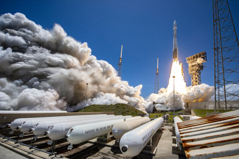 Smoke spews from a rocket launch.