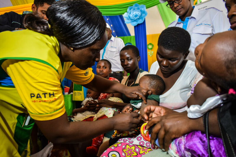 Image of a health worker administering a shot.