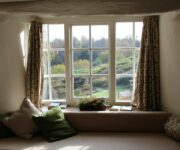interior bay window overlooking forest