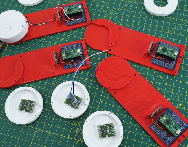 The motion capture suit comprises 3D-printed parts, each equipped with a magnetic rotary encoder, MPU-6050 IMU, and Teensy LC