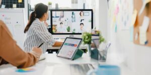 asia-businesspeople-using-desktop-talk-colleagues-discussing-business-brainstorm-about-plan-video-call-meeting-new-normal-office