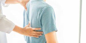 close-up-physiotherapist-working-with-patient-clinic