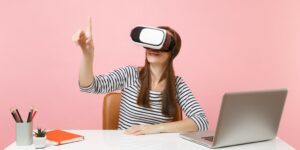 VR is a mess right now with so many companies convinced that collaboration and education over Virtual Reality requires classroom or conference room metaphor to function. But both the classroom and the conference room are constructs based on having to be in the same location physically which is not a requirement for virtual reality where your imagination, not your physical body, define the related construct. Right before the holiday break (in the US we mostly shut down during the last two weeks of the year), I took a briefing from Lenovo’s VR Classroom group and it is the first one in a long time where the approach optimized the tool set and did not try to recreate something that no longer made sense. Let us talk about why Lenovo’s VR Classroom is a better approach to remote education than the more common approach using avatars and virtual classrooms or conference rooms. The Recurring Mistake When we have a disruptive technology change, we tend to take the new technology and force it to do what we did before that technology emerged. The first cars were not only called horseless carriages, but they looked like horse drawn carriages without the horses. So, it is not surprising that so many of the collaboration tools we use try to recreate classrooms, conference rooms, even auditoriums at times failing to realize that every one of those constructs is optimized for physical bodies and defined by the need for everyone to be in the same place to communicate. There is something to be said for familiarity but using a technology that is optimized for people who are remote by faking an in-person event would seem to be suboptimal because physical rooms are limited while our imaginations and the VR technology we are now using have very different limitations and advantages. In addition, when we learn or collaborate the focus should be on either the project we are collaborating about, or the material we are learning. For instance, if we were collaborating on a building would not it make more sense, if we could, to go to the building site and do that work where the building is going rather than in a conference room remote from that site? While expensive and time consuming to do that physically, with a VR solution you can go anyplace instantly, making location learning and collaboration far more interesting and effective. Lenovo’s VR Classroom This is what Lenovo has figured out with their VR Classroom. They created a process where the focus is on the material to be learned and the engagement of the students rather than trying to recreate a virtual classroom. Using the Lenovo Mirage VR S3 headset, which emerged from their partnership with Pico, Lenovo created a comprehensive learning platform that focused students on the content to be learned and does not try to recreate the classroom experience. Using eye tracking teachers can tell whether the students are engaged and refine the related content over time to increase engagement. They can better focus on the content and have reported accelerated learning speeds and less behavioral problems because they can better monitor the students and fine tune the curriculum to provide the desired outcome. Tests are more interactive and focused more on reinforcing knowledge as opposed to the more typical mix of memorization and test taking skills. Training speed, rather than the more typical limitation of being set by the slower students, is more dynamic and designed to move at the rate optimal for any student. This helps both slow and fast students by assuring the slow students are not left behind and the fast students do not disengage out of boredom. While Lenovo’s initial roll out of this program focused on K-12 education exclusively it has since expanded to all levels of schools and includes professional training as well now. The solution is comprehensive as well with hardware, content, device management, and training and support. All these elements are required because teachers and trainers want to focus on the job of teaching, not on having to do their own installation and ongoing service and support. By taking on these burdens, Lenovo allows the teacher/trainer to do what they do best, which is teaching and training. Interesting courses include things like ethical finance, and they can do the avatar thing using Mozilla Hubs if needed for group games and team building activities. But the overall effort is to place the student immersivity into the content to be learned and focusing on the transfer of knowledge, not the recreation of the classroom to speed the learning process. Wrapping up: I think that many of the VR efforts that try to replicate classrooms, conference rooms, and auditoriums are wrong headed because they create artificial limitations on the process based on physical requirements that do not exist in the virtual world. Lenovo’s VR Classroom 2 effort appears to better take into account the capabilities and limitations of VR to craft a far more effective solution. The lesson here is that the best solutions focus first on the problem to be solved using the unique advantages of the new tool and rather than recreating the limitations of the old one. Lenovo’s approach is exactly that, they focused on VR’s ability for immersive learning and the result is a remote solution that is potentially far more effective than the in person process it replaces.