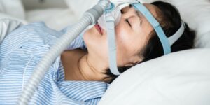 woman-wearing-anti-snoring-chin-straps