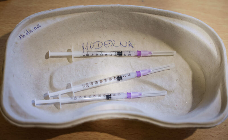 A tray of prepared syringes for booster vaccinations with Moderna's vaccine.