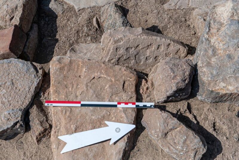 One stone among many is decorated with board game.