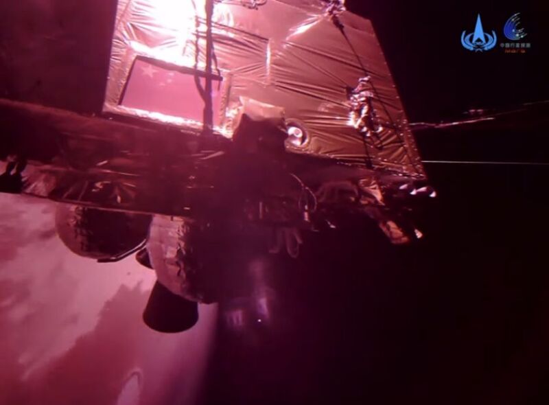 China's Tianwen-1 spacecraft flies above Mars.