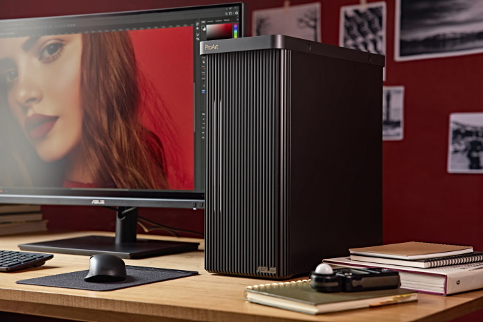 Asus PD5 on desk next to monitor