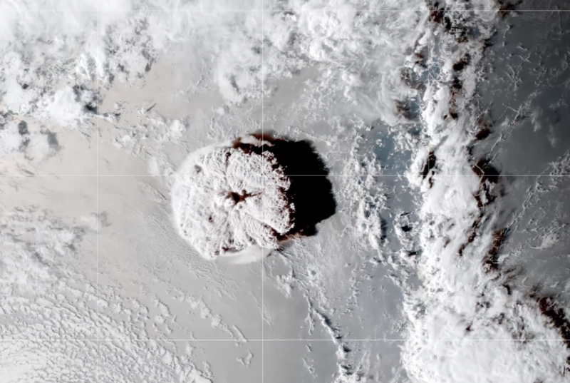 Image of a circular blast zone surrounded by clouds.