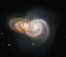 Hubble Telescope Snaps Enchanting Shot Of Two Galaxies Intertwined In Cosmic Embrace