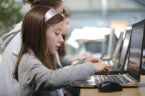 Young person using a computer.