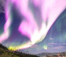 Solar Storm Rips A Hole In Earth's Magnetosphere Causing These Ultra-Rare Pink Auroras