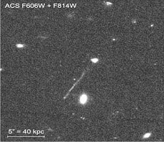 Supermassive Black Hole Streaks Across The Galaxy, Leaving Trail Of Gas And Stars