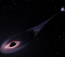 Hubble Spots A Runaway Black Hole Lunging Through Space With A Huge Star Tail