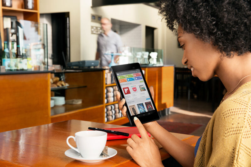 Someone poking at a 2013 Nexus 7, Google's last (and possibly only) great tablet.