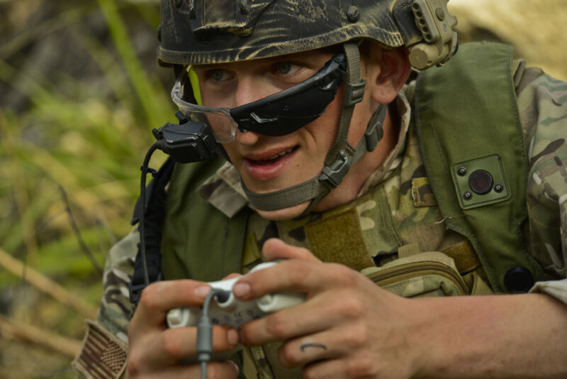 Senior Airman Ryan Hoagland operates an explosive ordnance disposal robot using an Xbox 360 controller.