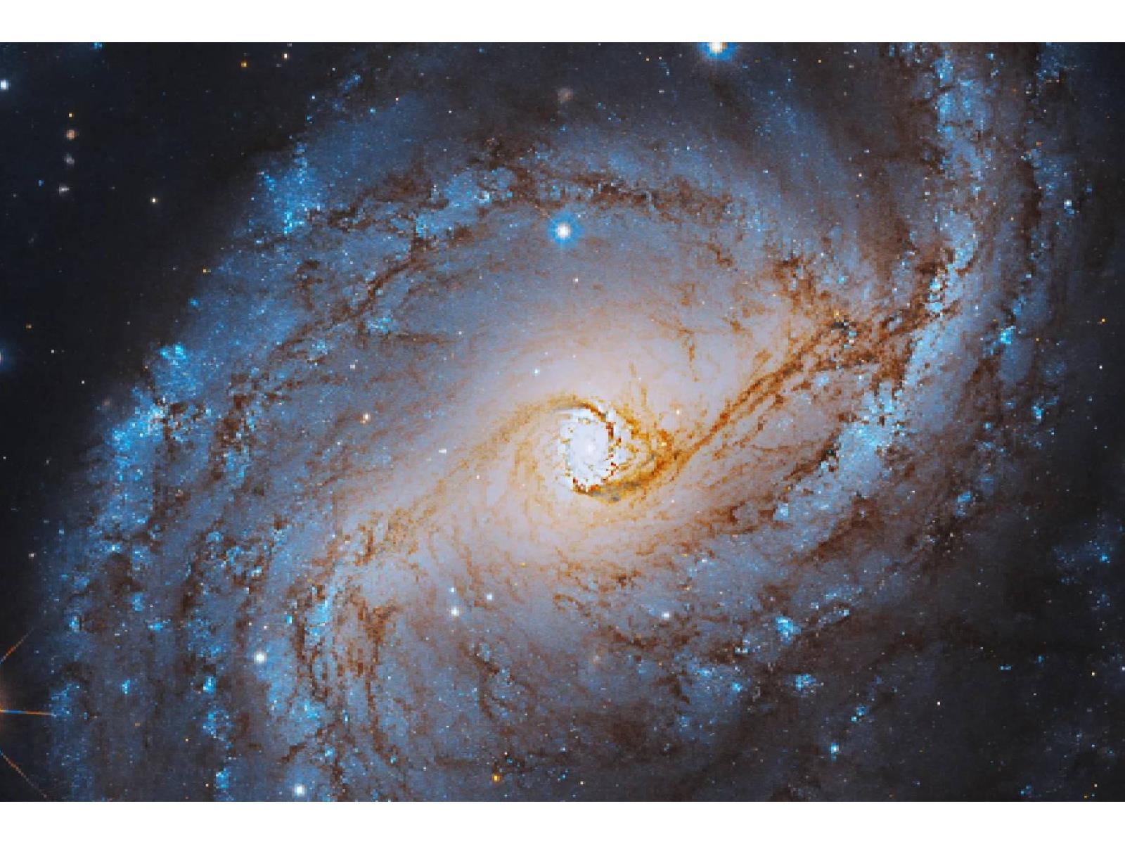 Hubble Captures Jaw-Dropping Image Of A Blue Spiral Galaxy Over 800M Years Old